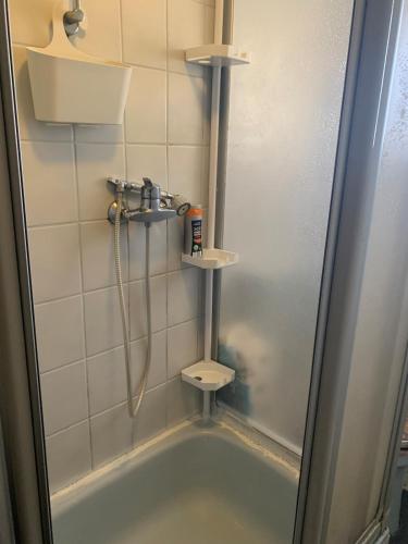 a bathroom with a shower and a bath tub at Kleine Wohnung in Overath in Overath