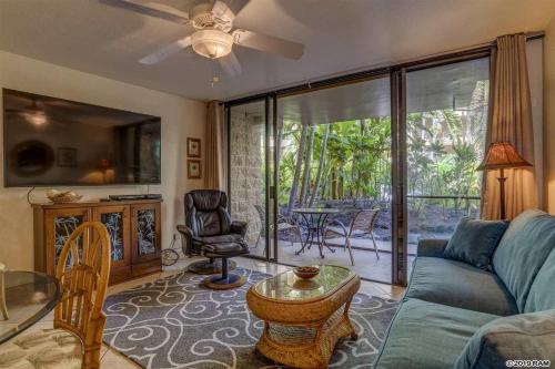a living room with a couch and a table at Awesome Paki Maui Beach condos in Lahaina in Lahaina