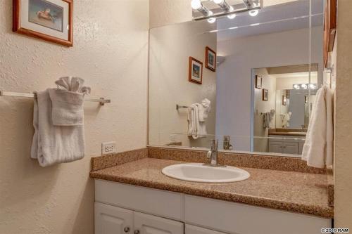 a bathroom with a sink and a mirror at Awesome Paki Maui Beach condos in Lahaina in Lahaina