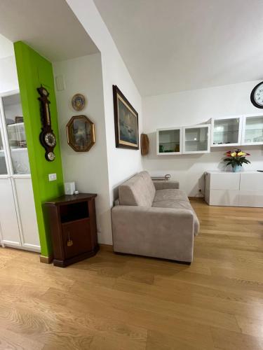 a living room with a couch and a table at Casa Conca D Oro in Rome