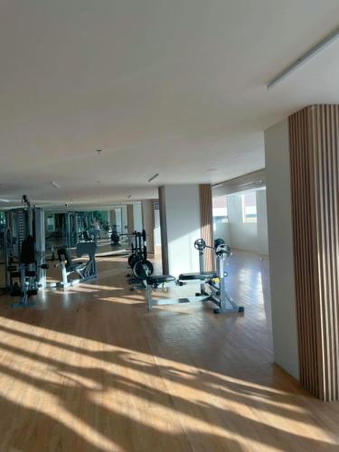 a gym with treadmills and machines in a building at Modern & Stylish Condo Rental P52 in Lapu Lapu City