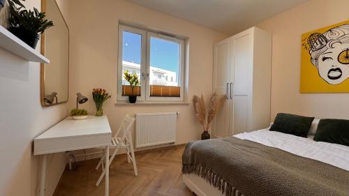 Postel nebo postele na pokoji v ubytování Apartament Podniebny - 4 sypialnie - Lake Apartments, osiedle Tuwima Park - Olsztyn