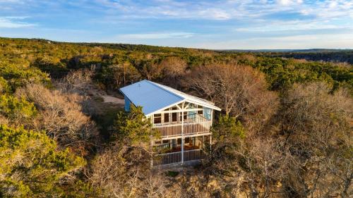 an overhead view of a house in the woods at The Clifftop Perch, 70ft above the dry Blanco in Wimberley