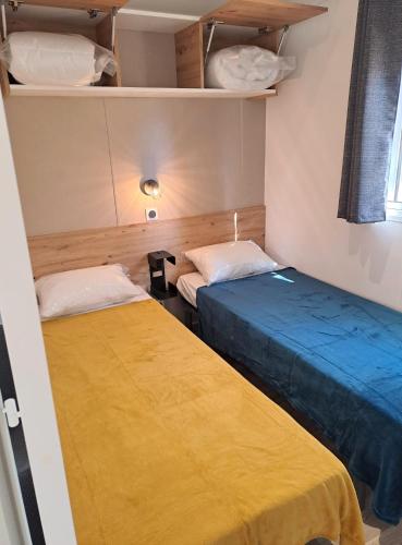 Katil atau katil-katil dalam bilik di Mobile home MIÊLLE