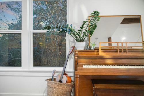 a pumpkin is sitting next to a piano at The Clifftop Perch, 70ft above the dry Blanco in Wimberley