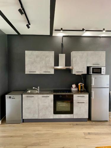 Η κουζίνα ή μικρή κουζίνα στο Emerald Apartment