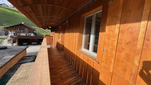 a wooden building with a window on the side of it at Time out near Lake of Thun & Emmental region in Fahrni