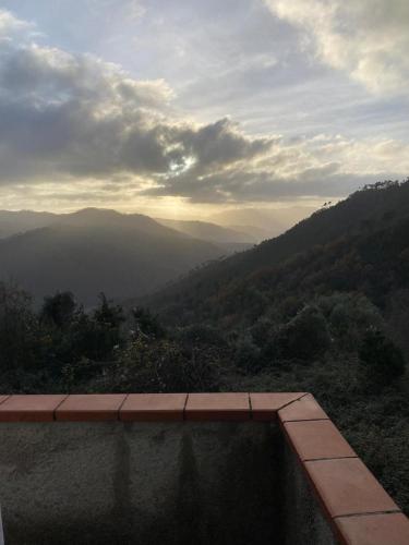 a view of a mountain valley with a infinity at La Casetta Valdonica La Spezia in Calice al Cornoviglio