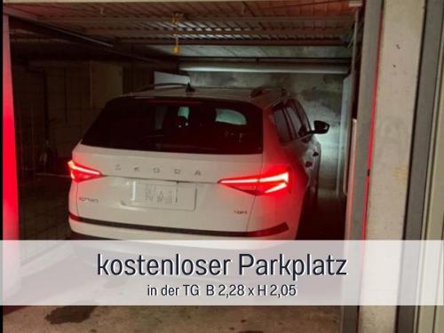 a car is parked inside of a garage at PENTHOUSE - 3 Schlafzimmer- sonnige Dachterrasse -Whirlpool & Alpenblick - Perfekt für Romantik oder Familienurlaub mit Kind, Hund willkommen - by FerienWohnenAmSee - in Überlingen