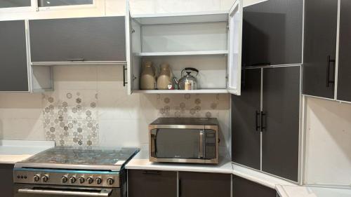 Dapur atau dapur kecil di شقق الوسام للايجار اليومي