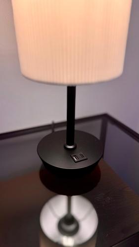 a lamp sitting on top of a table at Design Apartment im alten Schloss Deidesheim in Deidesheim