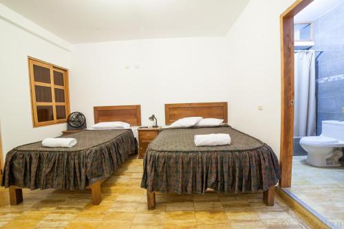 Postel nebo postele na pokoji v ubytování Hotel El Huarango