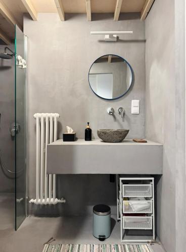 a bathroom with a sink and a mirror at Stepono Apartment in Vilnius