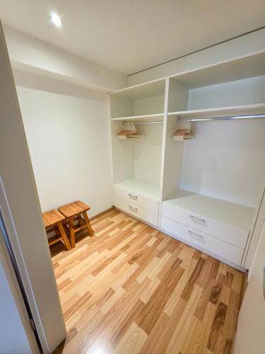 a room with white cabinets and a wooden table at Paradise mit Seesicht in Fluelen