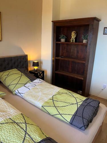 a bedroom with two beds and a dresser at Villa Yari in Lovran