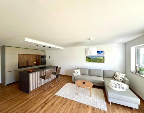a living room with a couch and a table at Ferienwohnung Alpspitze in Oy-Mittelberg in Oy-Mittelberg