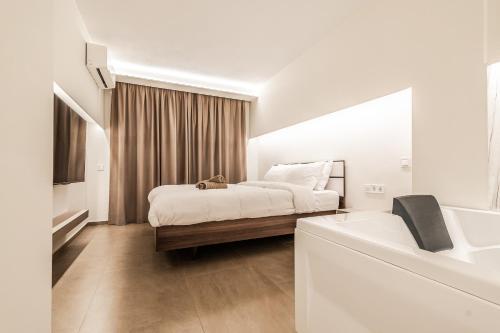 Ένα ή περισσότερα κρεβάτια σε δωμάτιο στο Eunoia Luxury Loft