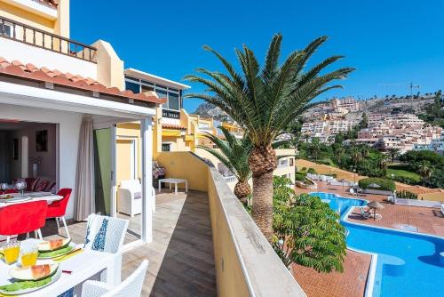 a villa with a swimming pool and a balcony with a view at Ines Luxury Costa Adeje in Adeje