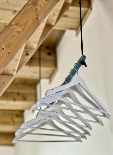 a white light fixture hanging from a ceiling at Apartmány Křivoklát in Křivoklát