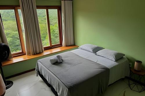 Letto o letti in una camera di Casa Miradouro do vale - Ar Condicionado nos dois quartos