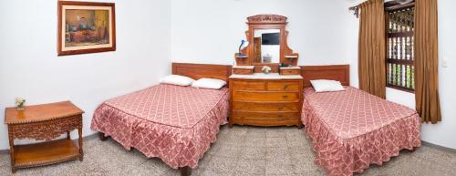 Postel nebo postele na pokoji v ubytování Hotel El Huarango
