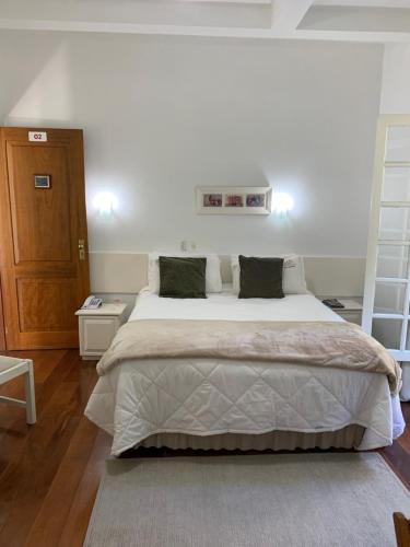 Ένα ή περισσότερα κρεβάτια σε δωμάτιο στο Hotel e Spa Provençal