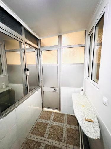a bathroom with a shower and a window at Lisbon Alcantara LX in Lisbon