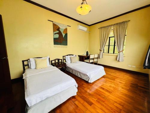Postel nebo postele na pokoji v ubytování Relaxing Home Villa Cecilia Tagaytay