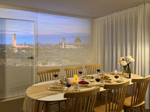 a dining room with a table with a view of a city at Bliss Stay 3mins to Gwangan Station in Busan