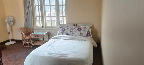 Letto o letti in una camera di Heritage View Homestay