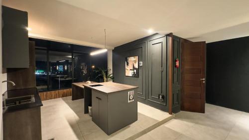 a kitchen with a counter and a sink in a room at Zenith Riverview in Rawalpindi