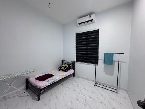 Postel nebo postele na pokoji v ubytování Homestay Tangkak Kasih Zaleha