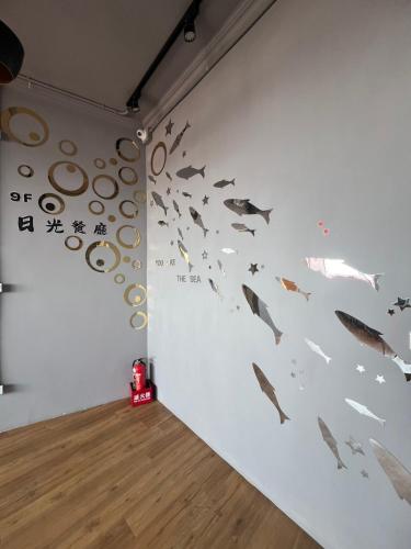 a room with a wall with fish on it at 可青大飯店Grand Ke-Cing Hotel in Yilan City