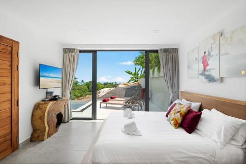 Ένα ή περισσότερα κρεβάτια σε δωμάτιο στο Casa Samui 4 Br Private Pool & Sea View