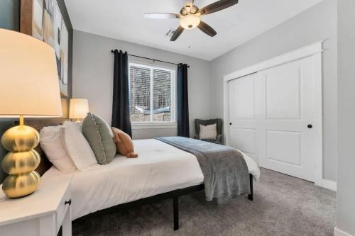 a bedroom with a bed and a ceiling fan at Large Flagstaff Home Near Violas with Hot Tub in Flagstaff