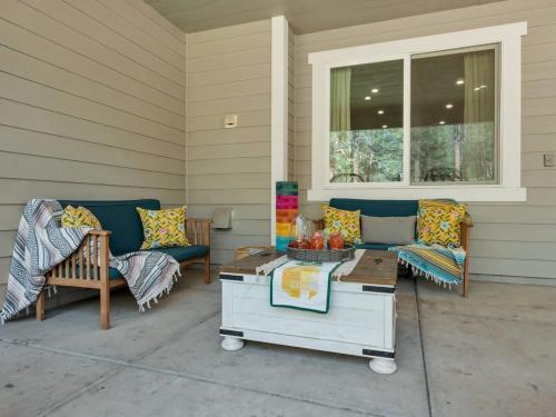 a porch with two couches and a coffee table at Large Flagstaff Home Near Violas with Hot Tub in Flagstaff