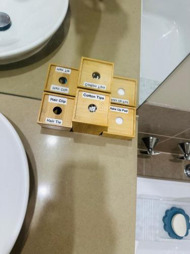 a wooden box sitting on a counter next to a toilet at Central Nest at Caroline Springs in Caroline Springs