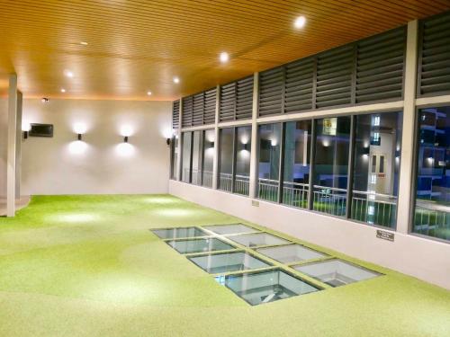 an empty building with glass floors and windows at Atlantis Residences Melaka in Melaka