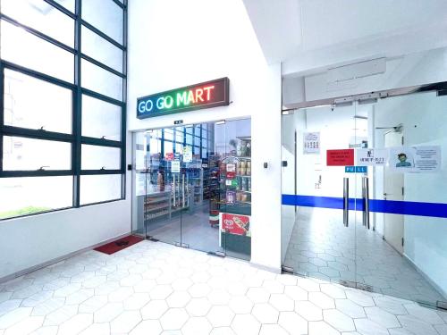 an entrance to a store with a go go market sign at Atlantis Residences Melaka in Melaka