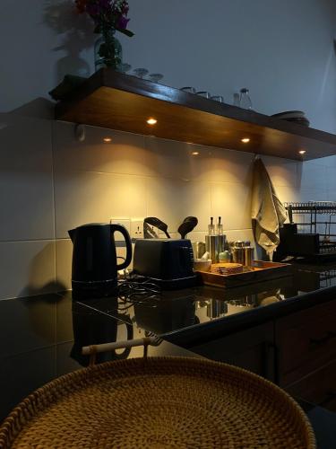 a kitchen with a counter top with a stove at makazi yetu - Makongo Area 4 in Dar es Salaam