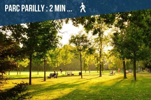 a park with trees and people in the grass at T3 L'Étoile NEUF Cosy & Lumineux - Gare Parilly in Vénissieux