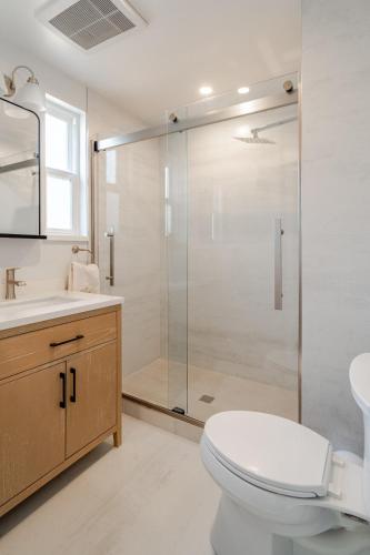 a bathroom with a shower and a toilet and a sink at 2 Palo Alto - Fully Furnished with Parking, Laundry, AC, Private in East Palo Alto