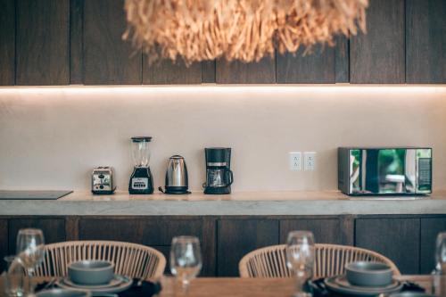 a table in a restaurant with chairs and a table sidx sidx sidx at Tulum Jungle Luxury Villa -Pvt Pool - Concierge 6A in Tulum