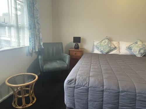 Ένα ή περισσότερα κρεβάτια σε δωμάτιο στο Earnslaw Motel