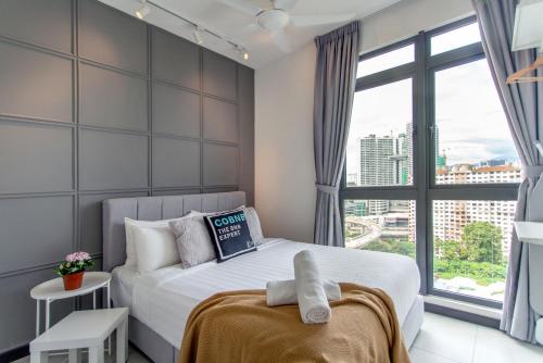 Ένα ή περισσότερα κρεβάτια σε δωμάτιο στο Neu Suites Ampang near LRT Jelatek
