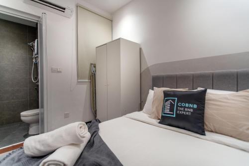 Ένα ή περισσότερα κρεβάτια σε δωμάτιο στο Neu Suites Ampang near LRT Jelatek