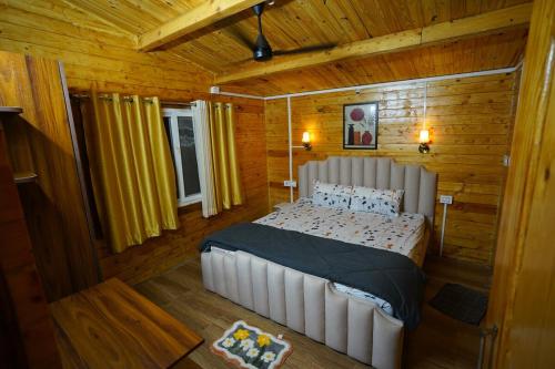 Postel nebo postele na pokoji v ubytování La Cabana, The Wooden Cottage