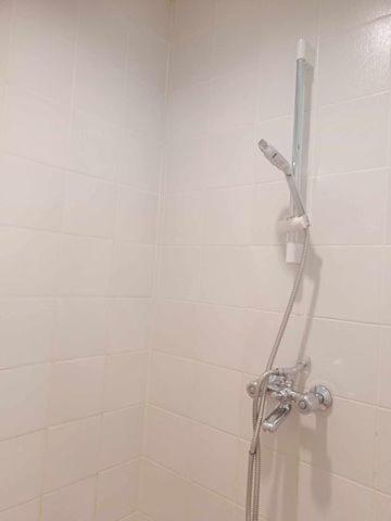 a shower in a bathroom with a shower at Porta Verde Resort Cavinti Laguna with Lake View in Cavinti
