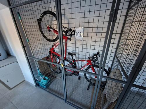 a bike in a cage in a room at Černý Potok 59 in Kryštofovy Hamry