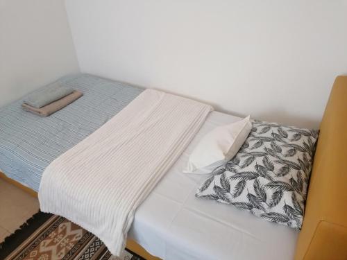 Postel nebo postele na pokoji v ubytování Apartman Centar 2